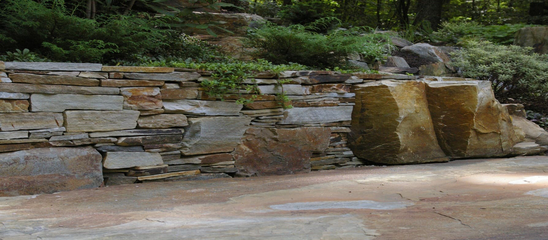 A stone retaining wall.